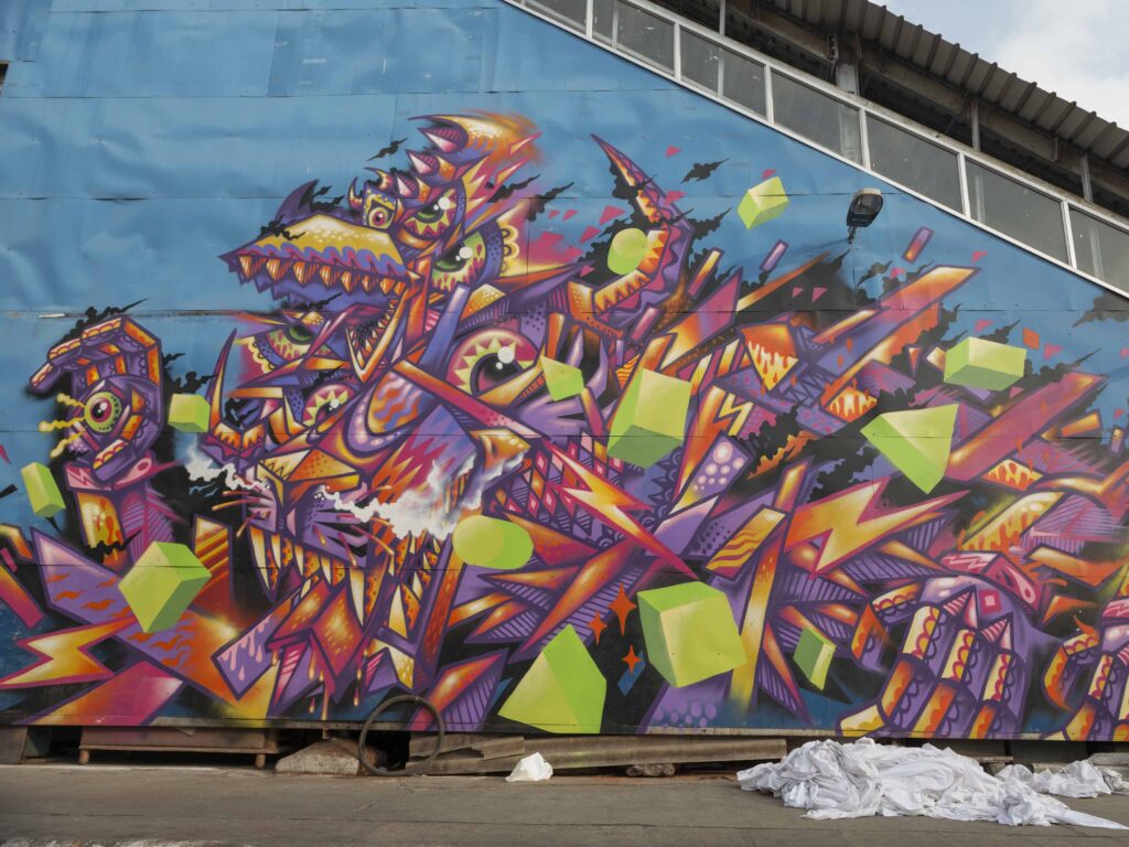 Detail of a mural by Base 23 showing a geometric monster